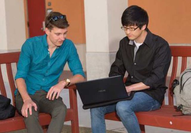 photo of canty and oh with laptop