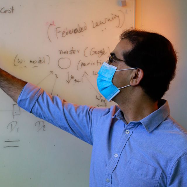 photo of ramtin pedarsani in the lab