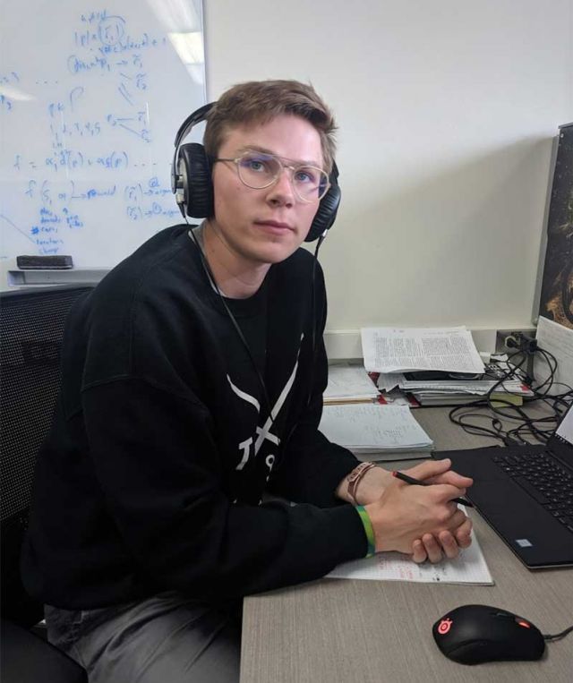photo of nate at work at his desk
