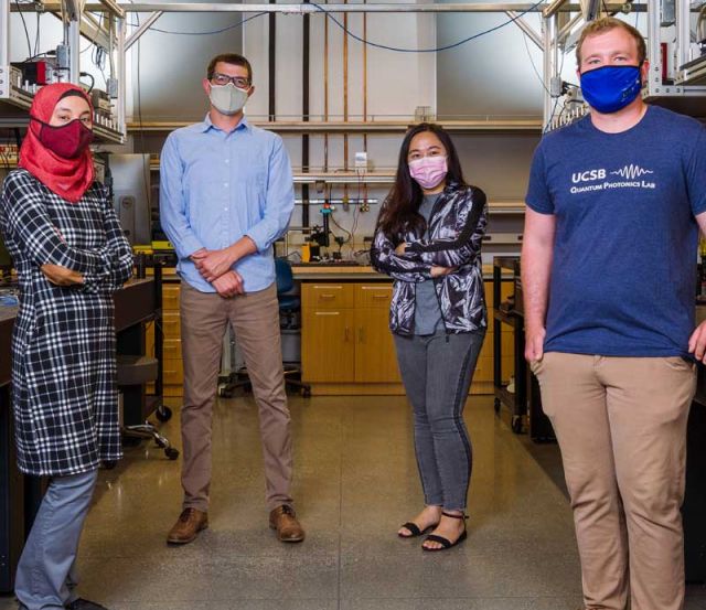 photo of moody and graduate researchers in the lab