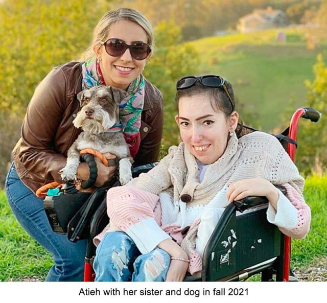 photo of taheri with her sister and her dog