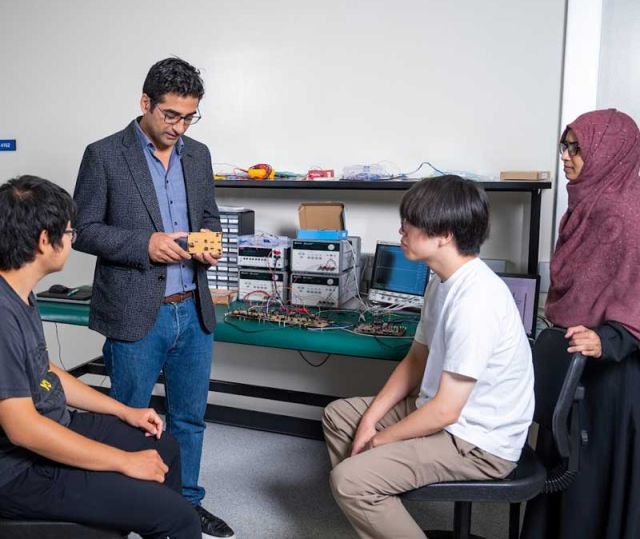 professor instructing in his lab