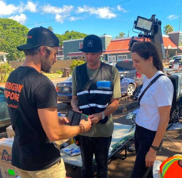 photo of Direct Relief giving out solar chargers