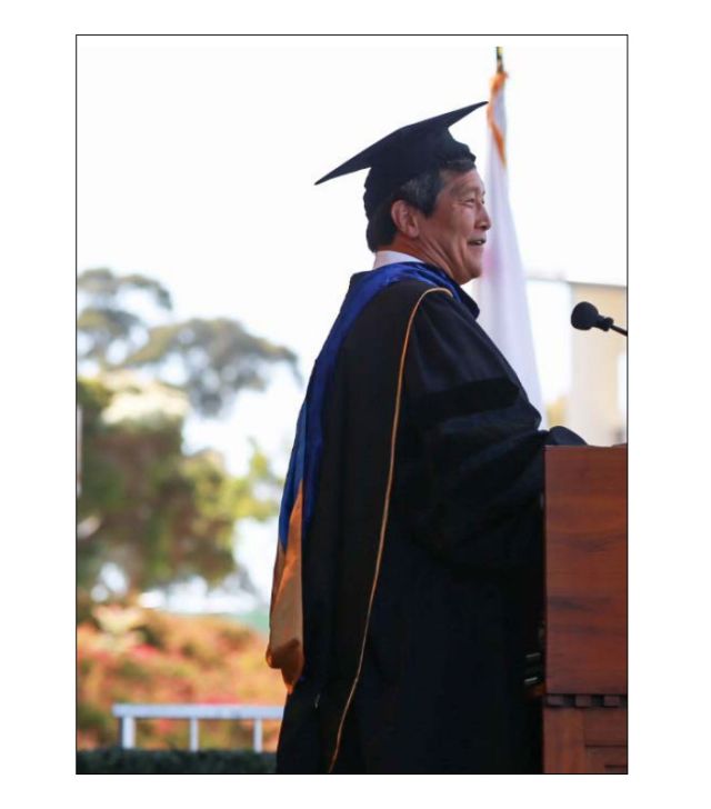 photo of wang at speaking at graduation