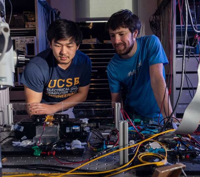 photo of students at the optical table setup