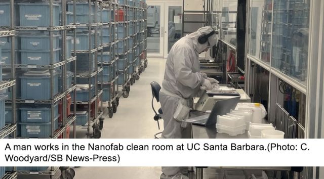 photo of man working in nanofab clean room