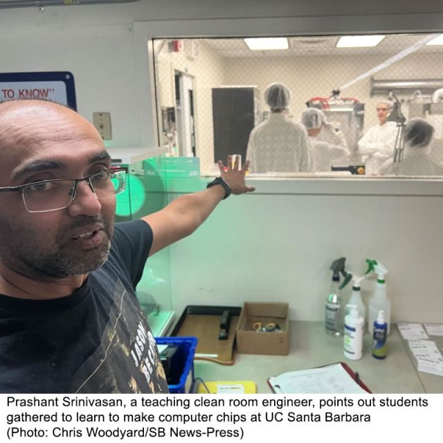 photo of prashant outside of cleanroom window with students inside