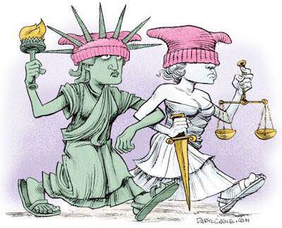 Lady Liberty and Lady Justice wearing protest pussy hats