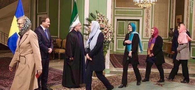 Female representatives of the Swedish government meet with Iranian officials