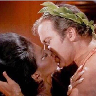 Captain Kirk of 'Star Trek' in a scene involving the first inter-racial kiss on American TV