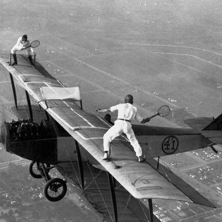 Two daredevils playing tennis on a flying airplane at 1000m altitude, Los Angeles, 1925