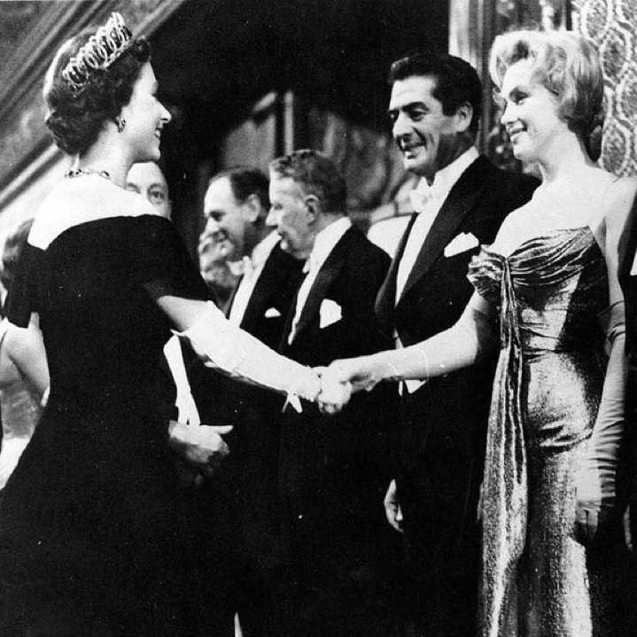 Queen Elizabeth II greets ... (Can you name the two on the right?)