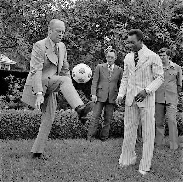 US President Gerald Ford trying to impress Pele with his soccer skills, 1975