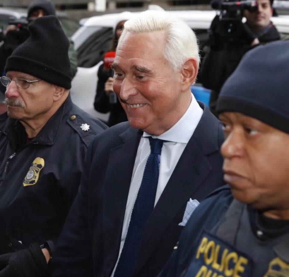 Roger Stone is all smiles as he is arrested