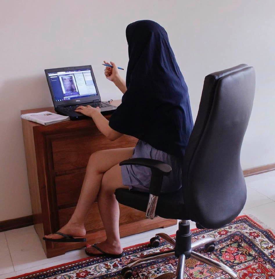 Woman professor teaches an on-line class in Iran