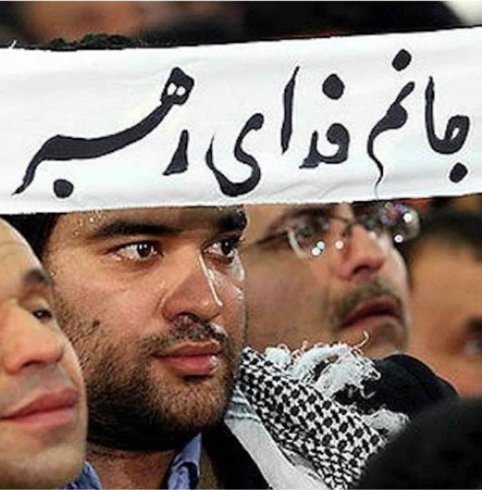 Brainwashed Iranians, at an audience with Khamenei, holding a banner that says they would give their lives for the Supreme Leader