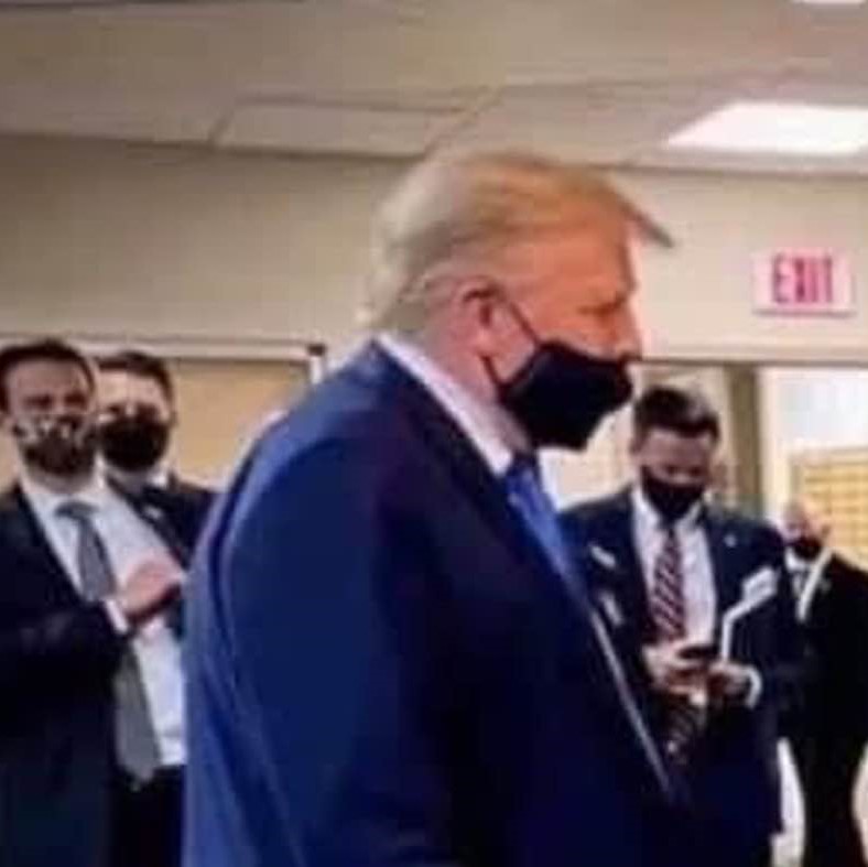 Trump wearing a face-mask covering only his mouth, not his nose