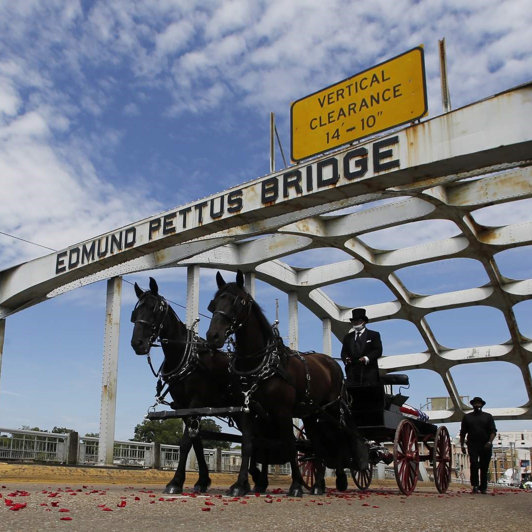 Congressman John Lewis's body travels over the Edmund Pettus Bridge, soon to be renamed in his honor