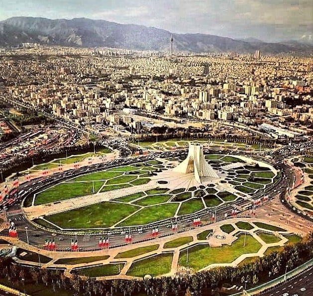 Panoramic view of Tehran and its two iconic pre- and post-revolution landmarks: Shahyad monument and Milad Tower