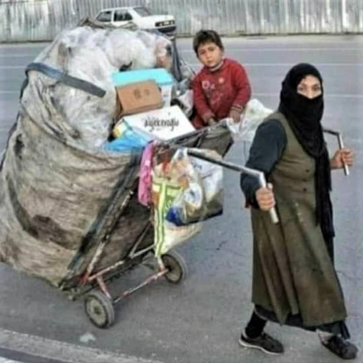 Iranian authorities take no offense at the sight of this destitute woman: But if she tries to ride a bike, all hell will break loose!