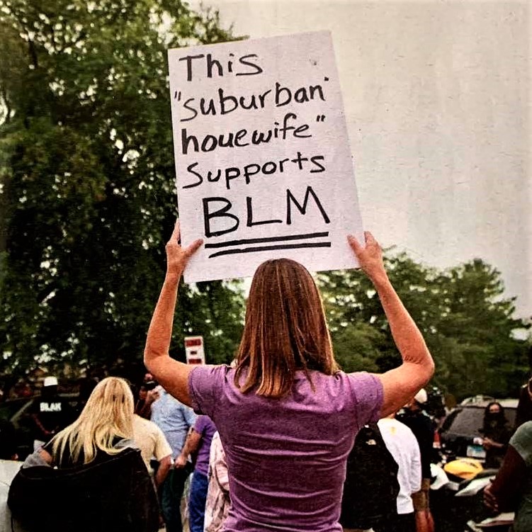 Protest sign: 'This suburban housewife supports BLM'