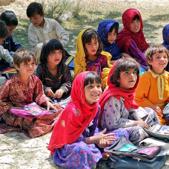 Afghan girls and boys in an outdoor classroom