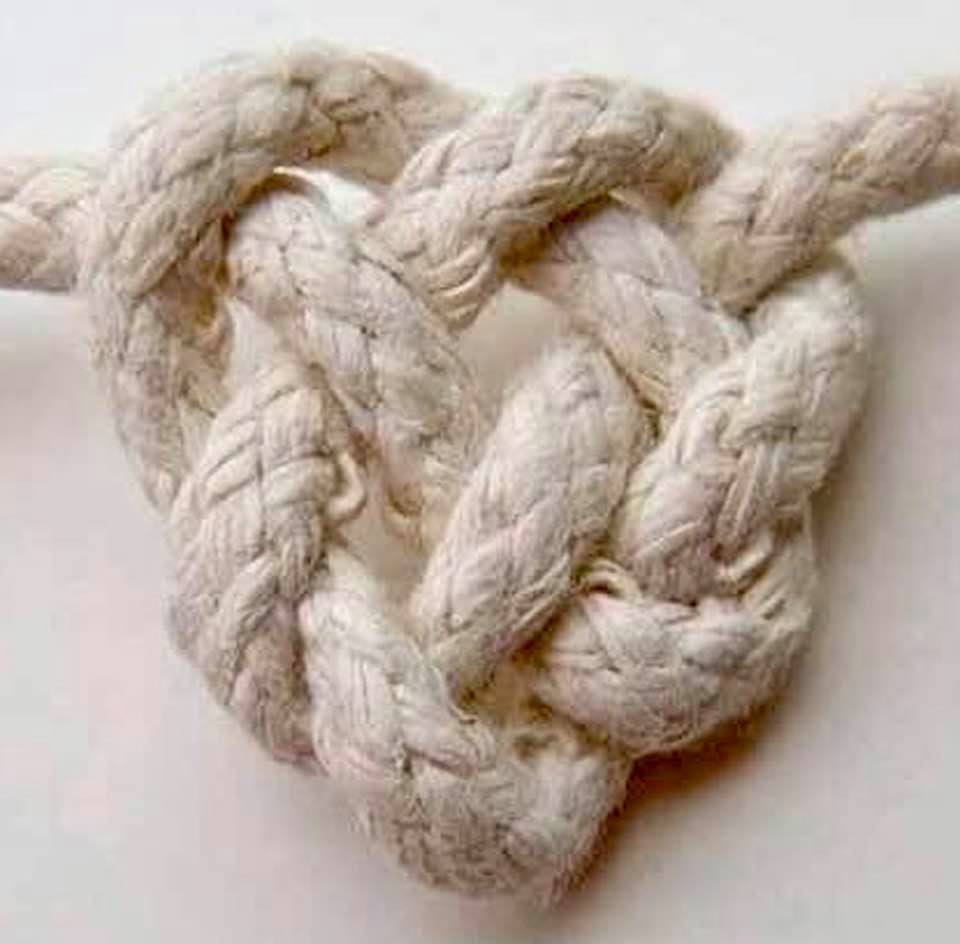 Rope with knots, tied to make a heart shape