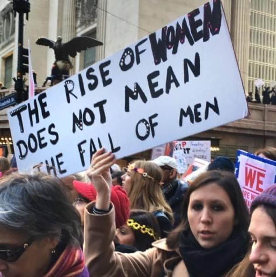Protest sign: 'The rise of women does not mean the fall of men