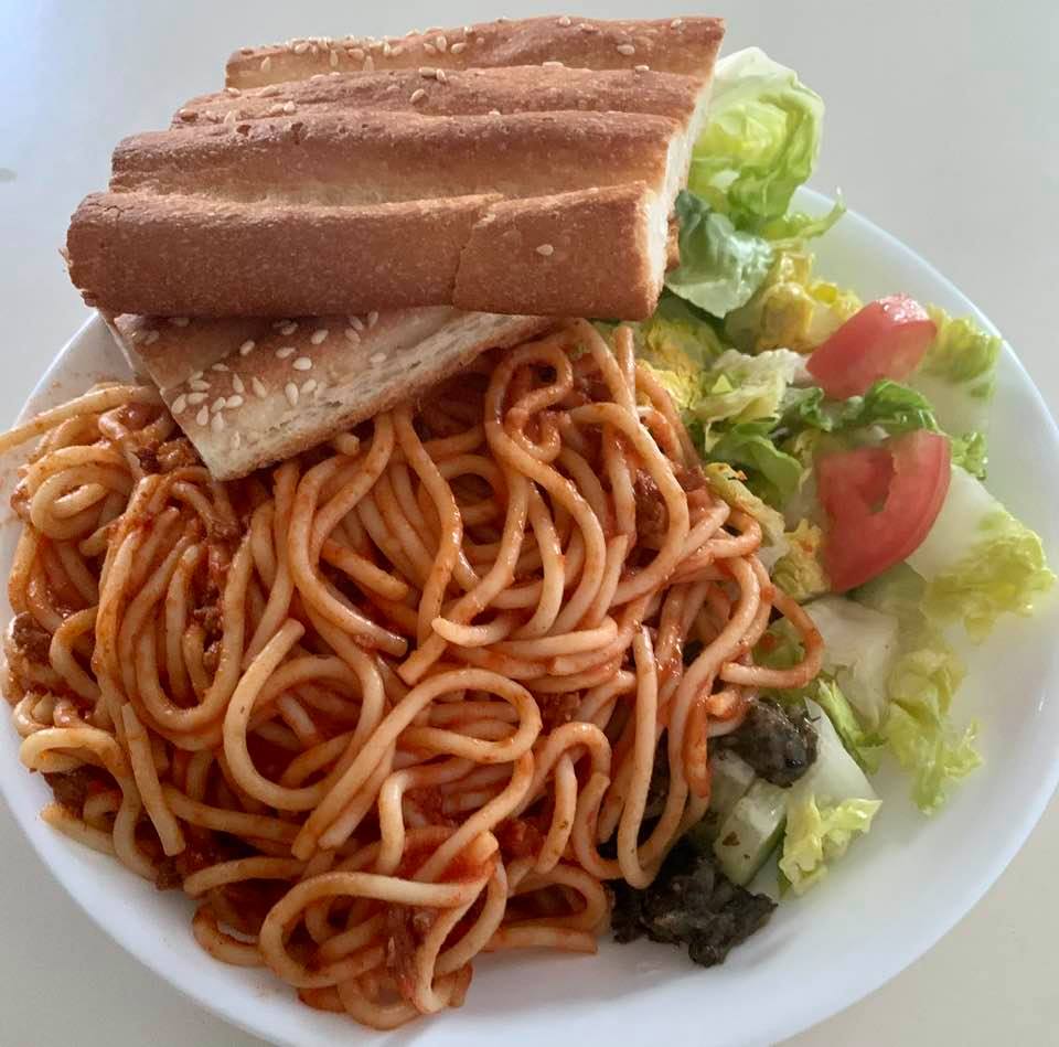 International combo meal: Pasta, salad, and barbari bread