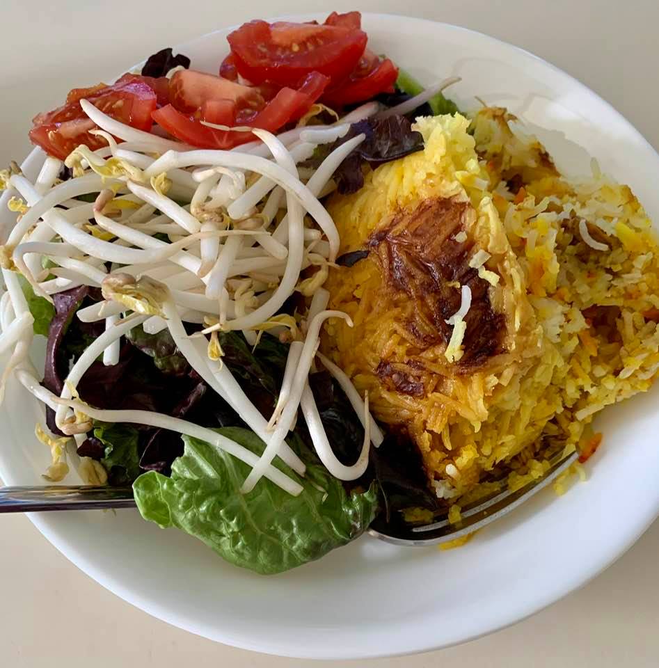 Tah-chin (rice layered with chicken, flavored with yogurt and saffron), courtesy of my mom, plus salad