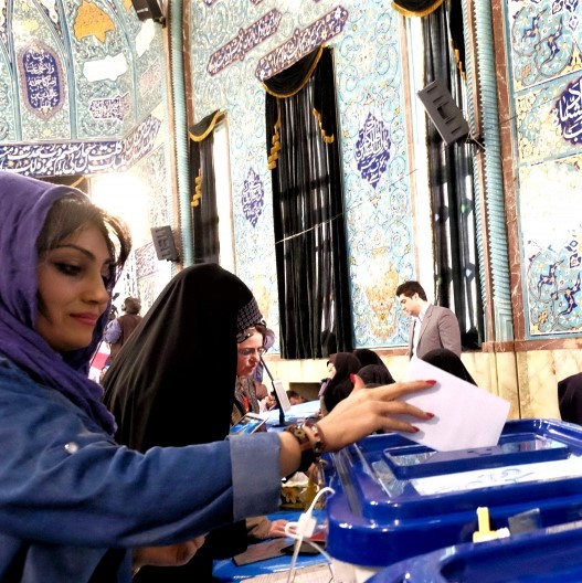 Iranian women shown at ballot boxes