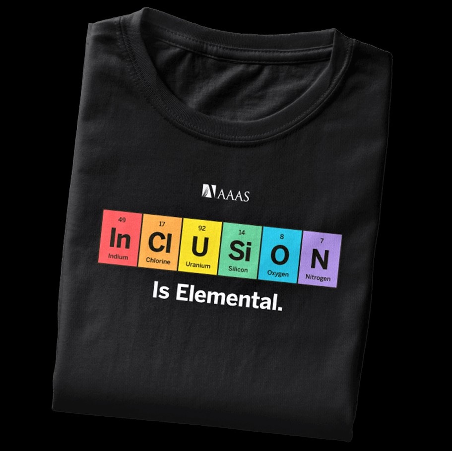 Message on a T-shirt used for marketing by AAAS: In-Cl-U-Si-O-N Is Elemental