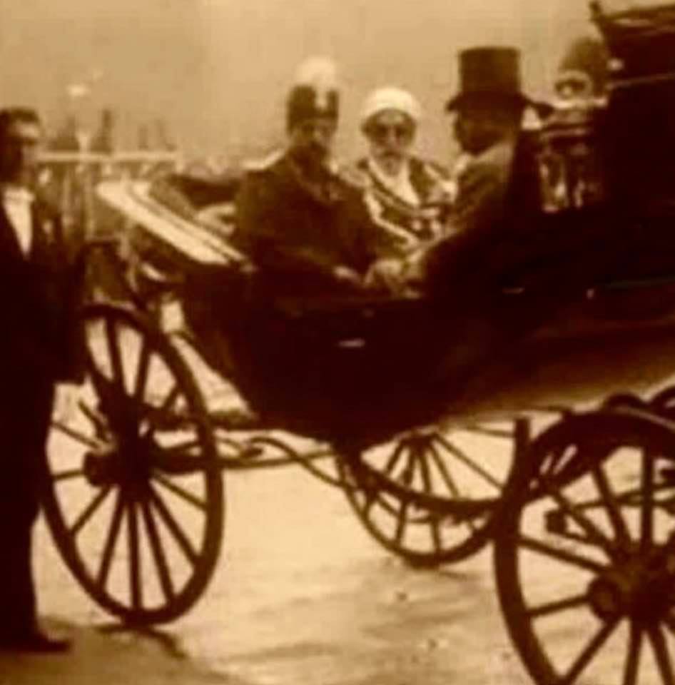 Grainy old photo showing Naser al-Din Shah Qajar on his first European trip, with Ayatollah Ahmad Jannati by his side