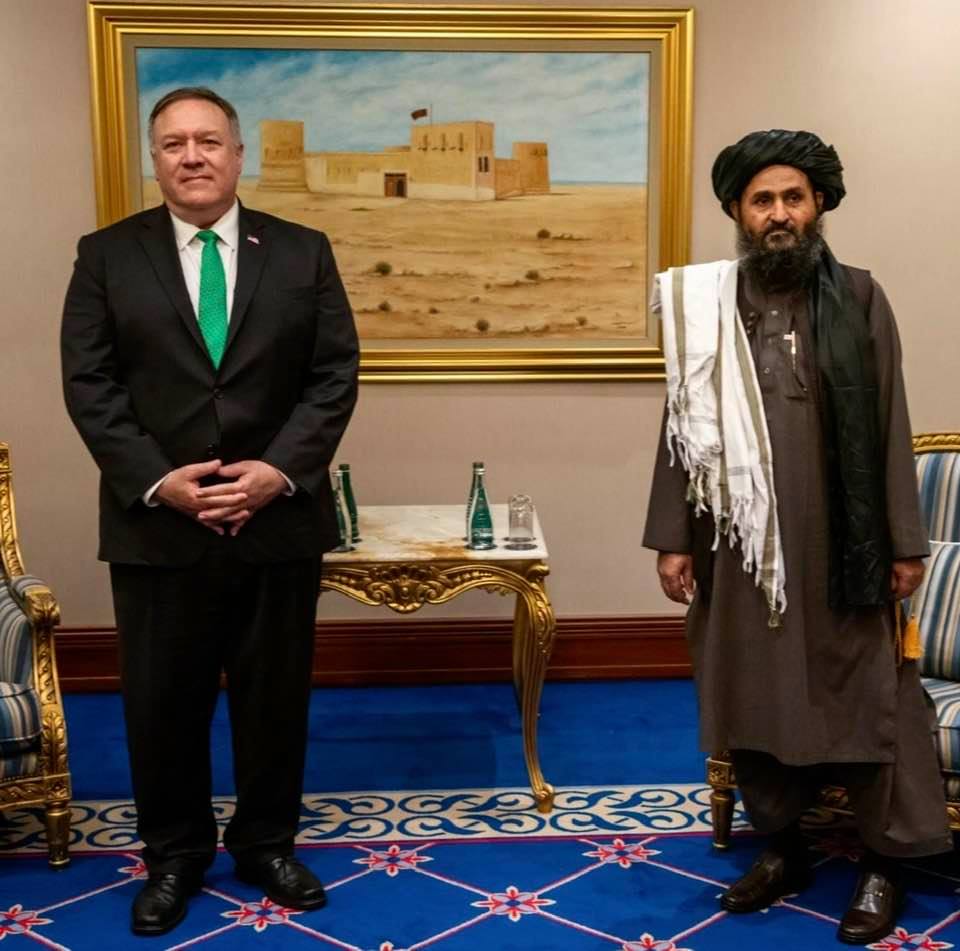 Photo-op: Former US Secretary of State with a Taliban leader in Doha, Qatar