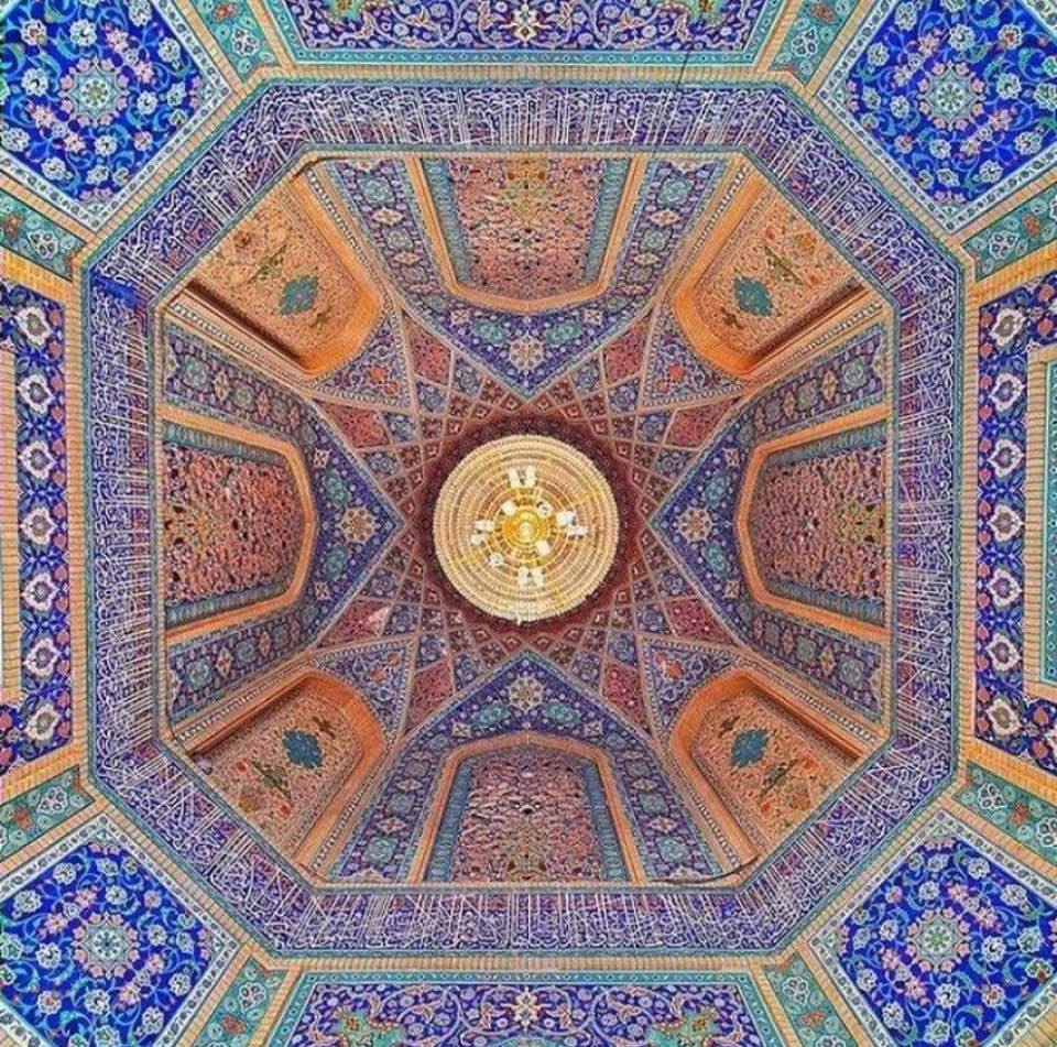 The beauty of symmetrical designs and color schemes in Iranian architectural tilings: Photo #1