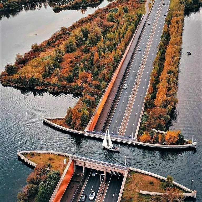 Water canal passing over a major highway in the Netherlands