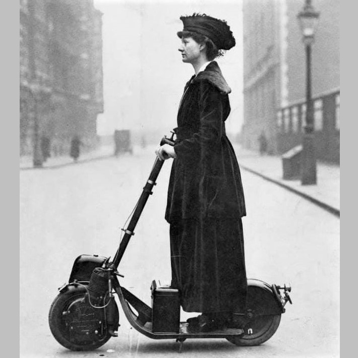 A suffragette in London: Lady Florence Norman going to her central-London office on a motorized scooter (1916)
