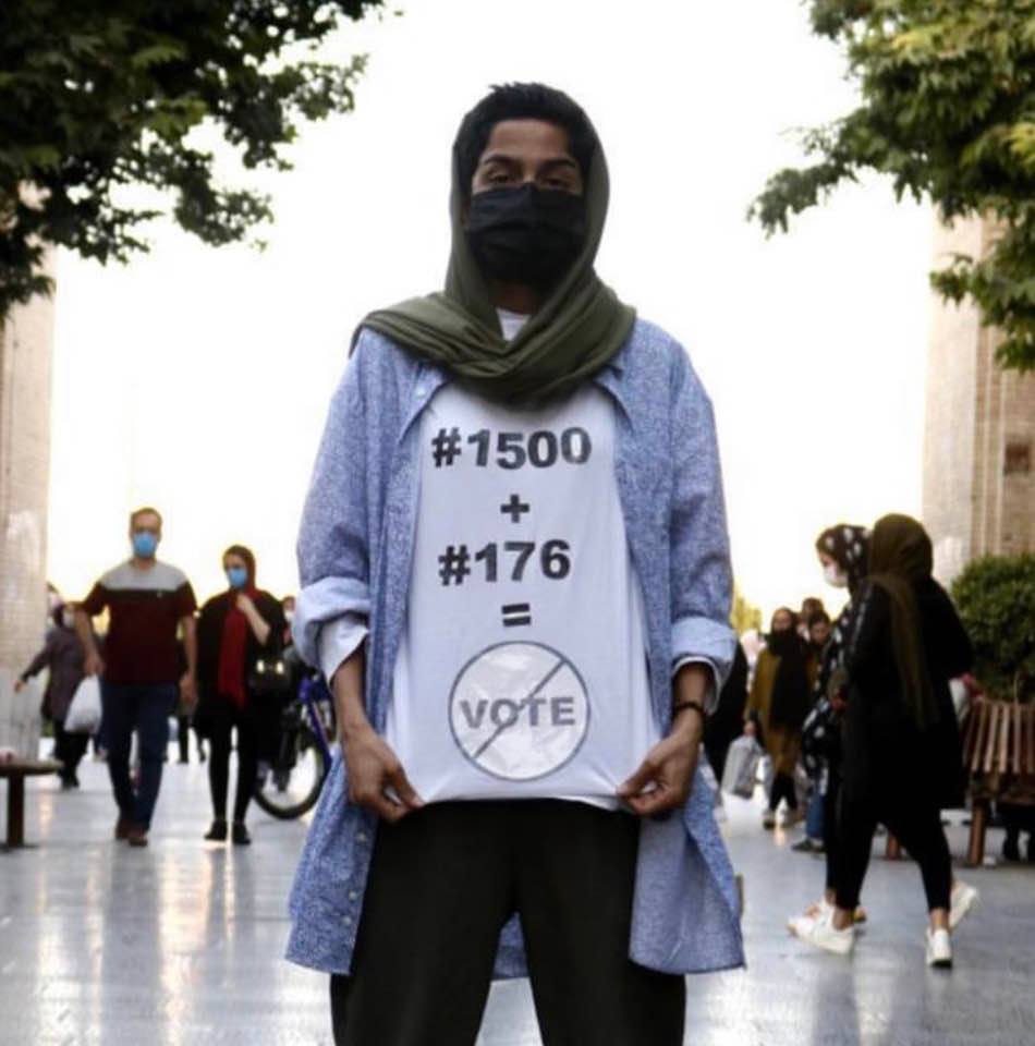Woman bearing a sign that reads '1500 + 176