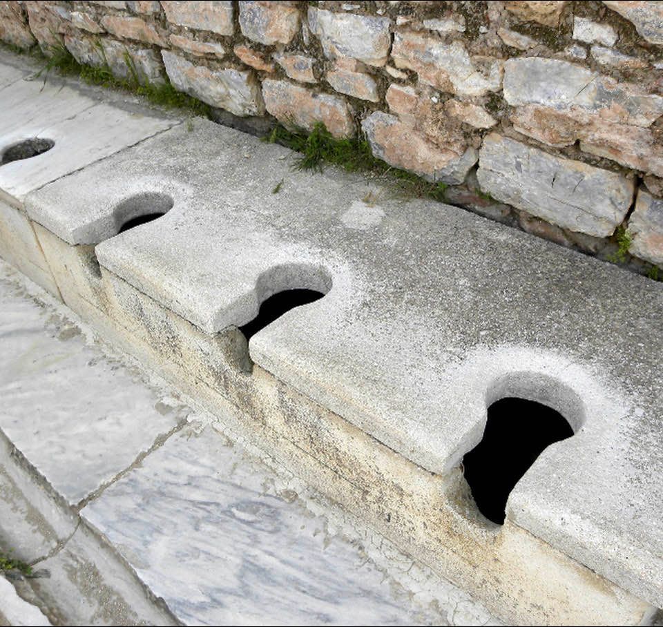 Row of toilets: Apparently, ancient Romans didn't care much about privacy when going to the bathroom