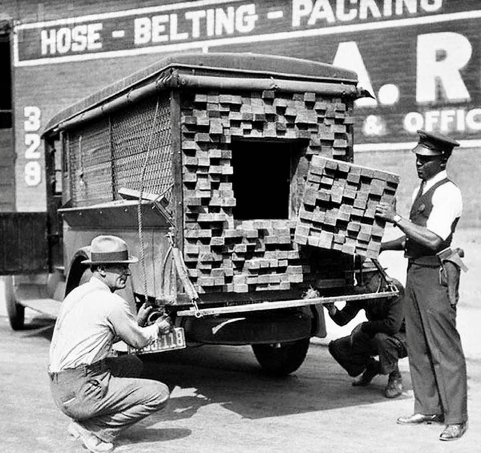 Federal agent inspects a 'lumber' truck in 1928 Los Angeles, during the prohibition era