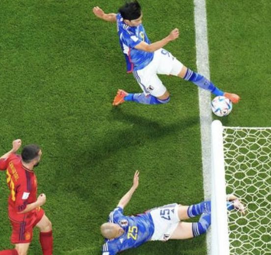 Controversial goal: The second Japanese goal against Spain appears to have come from a ball that went out of bounds