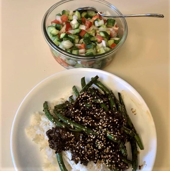 My daughter's sesame beef dish, with my Persian Shirazi salad