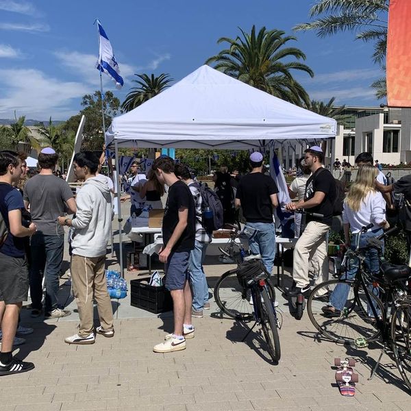 UCSB Jewish students set up a tent in front of the campus library to commemorate Israeli casualties