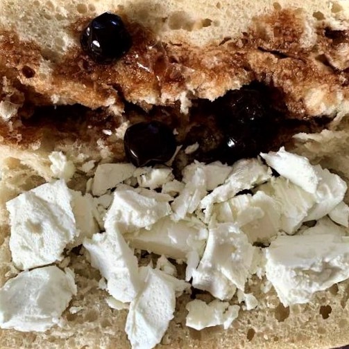 One of my favorite light meals: Feta cheese, with sour-cherry jam, on Costco baguettes or Iranian barbari bread